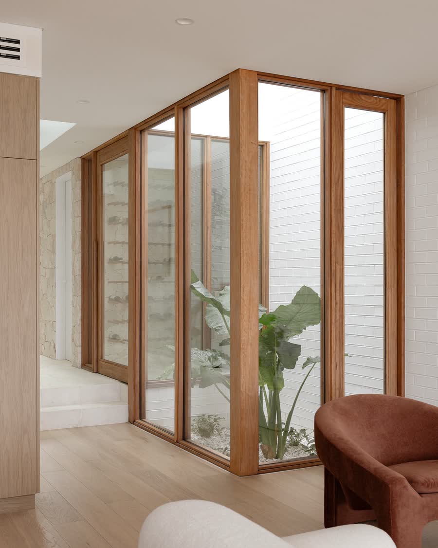 Internal courtyard framed in timber inside the Miranda duplex