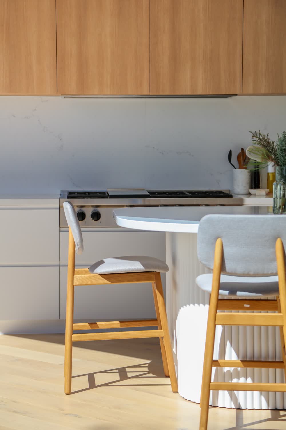 Curved island with timber stools