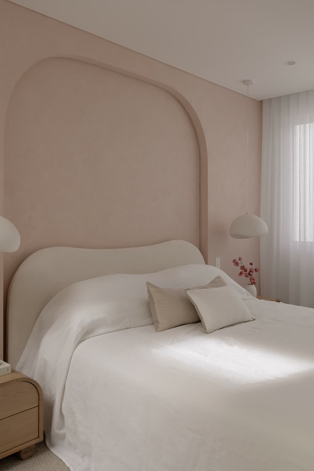 Main bedroom with a curved upholstered bedhead