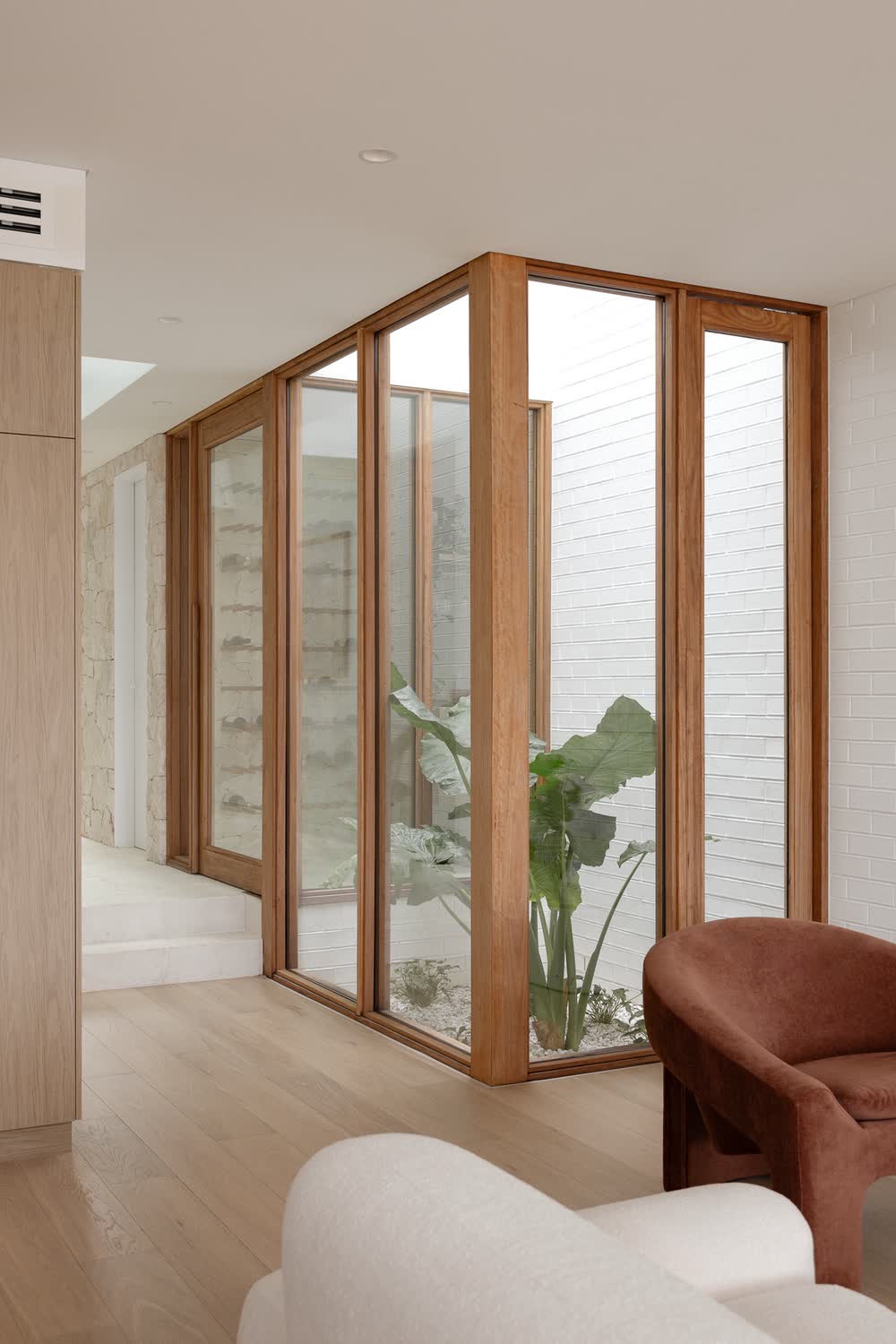 Internal courtyard framed in timber glazing
