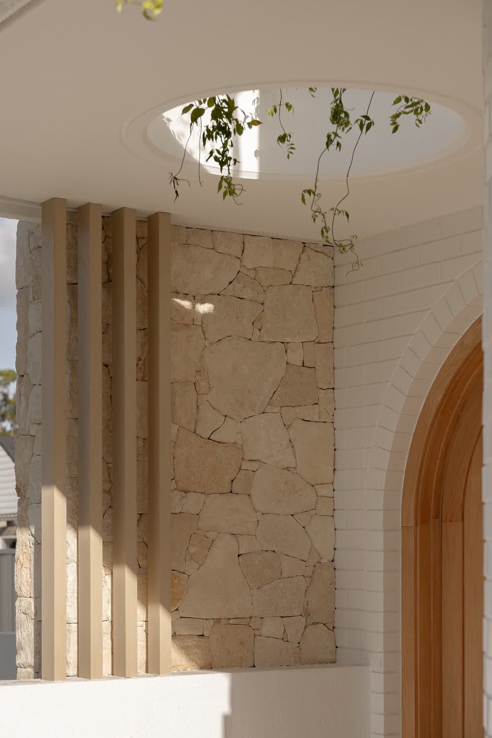 Oculus over a sandstone wall