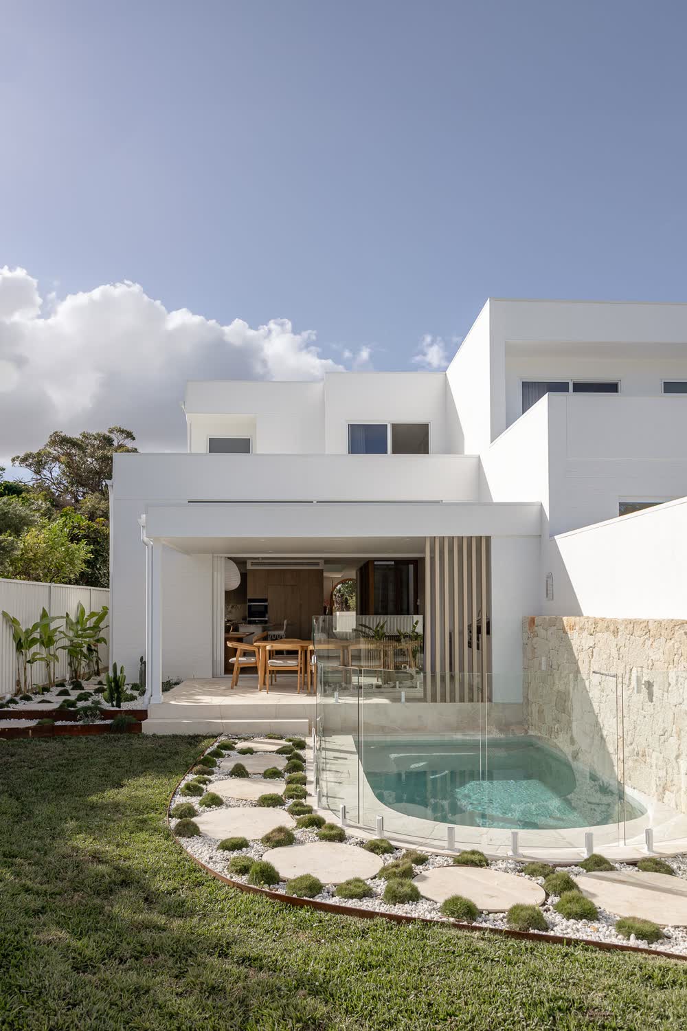 Rear of the duplex with a plunge pool and stepping-stone garden