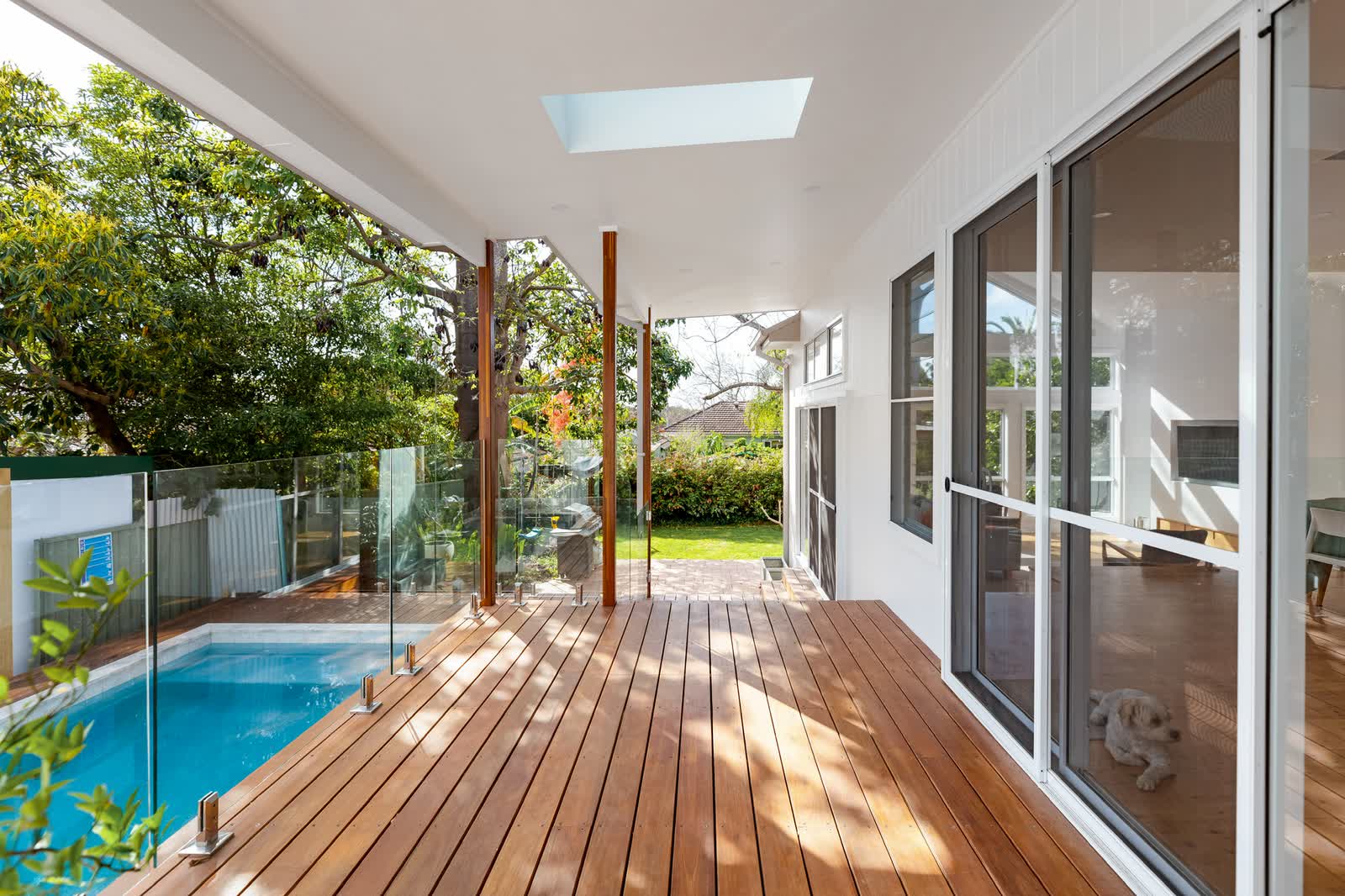 Covered deck beside the pool along the extension